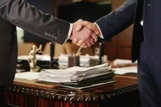 Two Business Partners Shaking Hands After Negotiations
